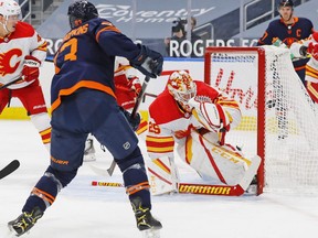Edmonton Oilers forward Ryan Nugent-Hopkins (93) scores a first period goal against Calgary Flames goaltender Jacob Markstrom (25) at Rogers Place on Feb. 21, 2021.