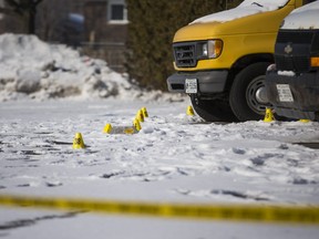 Evidence markers remain following a Saturday night fatal shooting of Abdulrahman Patel, 21, in the parking lot of a Scarborough strip plaza in the Sheppard Ave. E-Markham Rd. area in Toronto, Ont. on Sunday, February 7, 2021. ERNEST DOROSZUK/TORONTO SUN