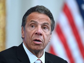 In this file photo Governor of New York Andrew Cuomo speaks during a press conference at the New York Stock Exchange (NYSE) on May 26, 2020 at Wall Street in New York City.