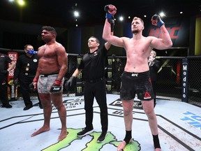 In this handout image provided by UFC, Alexander Volkov of Russia reacts after his knockout victory over Alistair Overeem of the Netherlands in their heavyweight fight during the UFC Fight Night event at UFC APEX in Las Vegas, Saturday, Feb. 6, 2021.