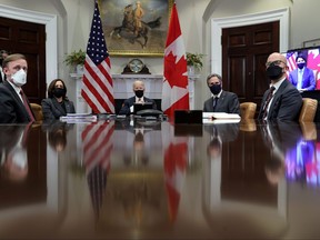 U.S. President Joe Biden is accompanied by White House National Security Advisor Jake Sullivan, Vice-President Kamala Harris, Secretary of State Antony Blinken and National Security Council Senior Director for the Western Hemisphere Juan Gonzalez during a video conference call with Prime Minister Justin Trudeau, from the White House in Washington, Feb. 23, 2021.