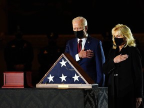 President Joe Biden and First Lady Jill Biden pay their respects to late U.S. Capitol Police officer Brian Sicknick, as he lies in honour in the Capitol Rotunda in Washington February 2, 2021.