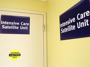 Signs mark the entrance to Belleville General Hospital's intensive care satellite unit in Belleville, Ont., Aug. 26, 2020.