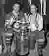 Frank Mahovlich and Red Kelly hold up four fingers indicating their fourth win of the Stanley Cup in the 1960s. This picture was from the post-game celebrations of the Toronto Maple Leafs’ 1967 Stanley Cup victory. HOCKEY HALL OF FAME PHOTO