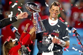 Tampa Bay Buccaneers quarterback Tom Brady celebrates with the Vince Lombardi Trophy after beating the Kansas City Chiefs in Super Bowl LV. It was his seventh Super Bowl victory. USA TODAY SPORTS