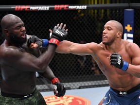 In this handout image provided by UFC, Ciryl Gane, right, of France punches Jairzinho Rozenstruik of Suriname in a heavyweight bout during the UFC Fight Night event at UFC APEX on Feb. 27, 2021 in Las Vegas, Nevada.