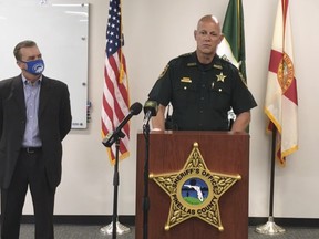 In this screen shot from a YouTube video posted by the Pinellas County Sheriff's Office, Pinellas County Sheriff Bob Gualtieri speaks during a news conference as Oldsmar, Fla. Mayor Eric Seidel, (left) listens, Monday, Feb. 8, 2021, in Oldsmar, Fla. Authorities say a hacker gained access to Oldsmar's water treatment plant in an unsuccessful attempt to taint the water supply with a caustic chemical.