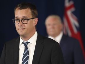 Monte McNaughton, Minister of Labour, Training and Skills Development, speaks at the lectern as the government gives an update on the COVID-19 situation in the province at Queen's Park June 24, 2020.