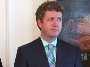 Nova Scotia Lands and Forestry Minister Iain Rankin listens as Premier Stephen McNeil announces changes to his cabinet in Halifax on Thursday, July 5, 2018.