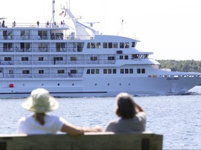 The cruise ship Pearl Mist makes its way upriver on the St. Lawrence as it passes Brockville, Ont., July 16, 2015.