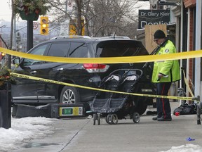 A Toronto Police officer investigates after an SUV hit a woman on St. Clair Ave., near Dufferin St. The woman, a nanny, was rushed to hospital with undisclosed injuries.