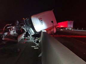 A collision involving an SUV, pickup truck, and transport filled with wine on Hwy. 401 between Hwy. 6 S. and Guelph Line late Thursday, Feb. 4, 2021.
