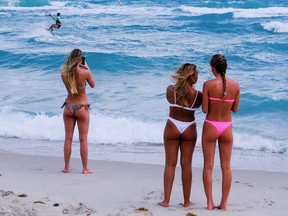 Spring break tourists from New Jersey enjoy the beach in Miami March 19, 2020.