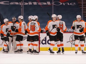 Philadelphia Flyers players celebrate after their game against the Washington Capitals at Capital One Arena in Washington, D.C., Feb. 7, 2021.