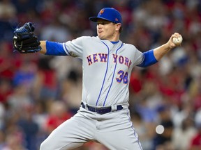 Justin Wilson of the New York Mets throws a pitch in the bottom of the seventh inning against the Philadelphia Phillies at Citizens Bank Park on August 30, 2019 in Philadelphia, Pa.