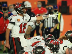 Quarterback Tom Brady of the Tampa Bay Buccaneers signals during the fourth quarter against the Kansas City Chiefs in Super Bowl LV at Raymond James Stadium on Feb. 7, 2021 in Tampa, Fla.