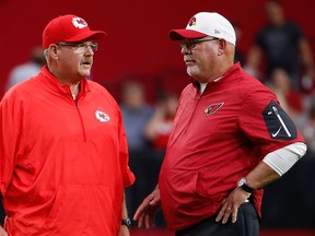Head coaches Andy Reid of the Kansas City Chiefs and Bruce Arians, hen with the Arizona Cardinals, talk before a pre-season game in 2015. No doubt they were making plans to coach against each other in the Super Bowl six years down the road.