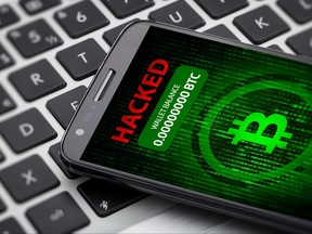 A message appears on a hacked phone to illustrate cryptocurrency theft in this file photo.