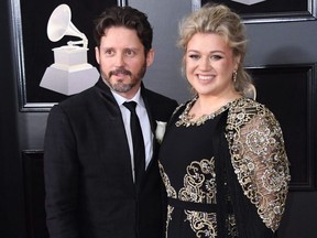 Kelly Clarkson and Brandon Blackstock arrive for the 60th Grammy Awards in New York City, Jan. 28, 2018.