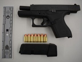 Samir Unoos, 23, of Toronto, faces numerous charges after cops allegedly seized this Glock 42 handgun, ammunition, cash, drugs and stolen licence plates during a vehicle stop near Bloor St. E. and Sherbourne St. on Friday, Jan. 29, 2021.