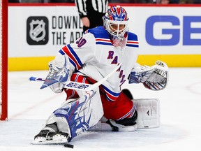 New York Rangers goaltender Henrik Lundqvist makes a save against the Detroit Red Wings at Little Caesars Arena.