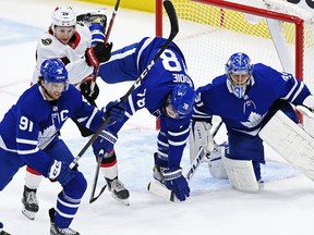 Maple Leafs goaltender Frederik Andersen looks for the puck as Ottawa Senators' Connor Brown and Leafs defenceman T.J. Brodie battle and Leafs' John Tavares looks on during the first period in Toronto on Wednesday, Feb. 17, 2021.