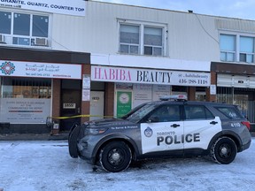 Toronto Police at the scene at a Lawrence Ave. E. plaza on Tuesday, Feb. 9, 2021, the day after a fatal shooting.
