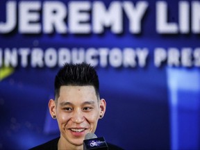 In this file photo taken on Sept. 26, 2019, former NBA player Jeremy Lin of the U.S. speaks during an introductory press conference held by his new team Beijing Shougang in Beijing.