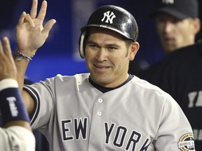 Johnny Damon is seen celebrating a run for the Yankees in a game against the Blue Jays at the Rogers Centre in Toronto, Aug. 4, 2009.