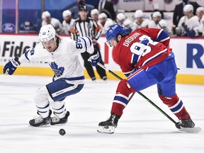 William Nylander of the Toronto Maple Leafs and Jonathan Drouin of the Montreal Canadiens skate after the puck at the Bell Centre on February 10, 2021 in Montreal.