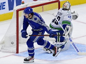 Maple Leafs centre Auston Matthews scores on Vancouver Canucks goaltender Braden Holtby during the first period on Saturday night at Scotiabank Arena.