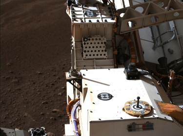 The primary-colour and grayscale calibration target (the colourful circular object at right foreground) used by the Mastcam-Z, a pair of zoomable cameras, as well as the secondary calibration target (the small colorful L-bracket just below the primary target) are seen in a natural-colour composite on NASA's Perseverance Mars rover on Mars, Saturday, Feb. 20, 2021.