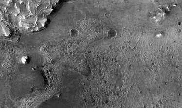 A green dot marks where NASA's Perseverance Mars rover landed in Jezero Crater on Mars Thursday, Feb. 18, 2021, in a base image taken by the HiRISE camera aboard NASA's Mars Reconnaissance Orbiter.