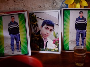 The portrait of Guatemalan migrant Rivaldo Danilo (16), believed to be among the 19 people killed in Mexico, is veiled at his house in Tuilelen village, Guatemala on January 28, 2021.