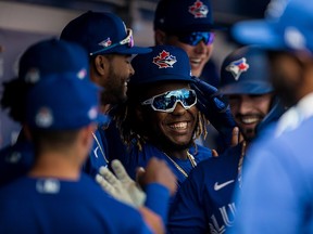 Toronto Blue Jays third baseman Vladimir Guerrero Jr. (27) celebrates a homerun with teammates during a game against the Baltimore Orioles at TD Ballpark.