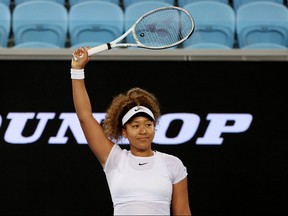 Japan's Naomi Osaka celebrates after winning her quarterfinal match against Romania's Irina-Camelia Begu in Melbourne Park, Melbourne, Australia, Feb. 5, 2021.