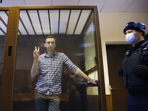 Russian opposition leader Alexei Navalny attends a hearing to consider an appeal against an earlier court decision to change his suspended sentence to a real prison term, in Moscow, February 20, 2021.