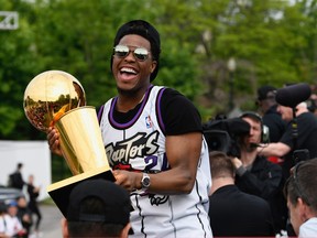 Toronto Raptors guard Kyle Lowry holds the Larry O'Brien Trophy during Raptors victory parade celebration in Toronto, Ontario, Canada, June 17, 2019.