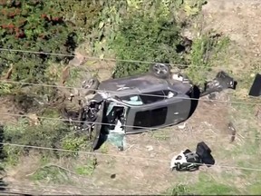 The vehicle of golfer Tiger Woods, who was rushed to hospital after suffering multiple injuries, lies on its side after being involved in a single-vehicle accident in Los Angeles, California, U.S. in a still image from video taken February 23, 2021.