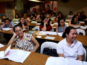 Filipino workers, including nurses applying to work in United Kingdom, attend a lecture in Manila, Philippines, April 2, 2019.