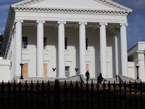 Law enforcement officers patrol on the grounds of Virginia State Capitol, days ahead of President-elect Joe Biden inauguration, in Richmond, Virginia, U.S. January 17, 2021.