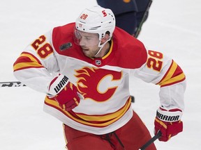 Calgary Flames forward Elias Lindholm looks for the puck in a blowout loss to the Oilers on Saturday. GREG SOUTHAM/POSTMEDIA NETWORK