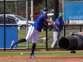 Cavan Biggio works on his throws from third base yesterday at Dunedin.