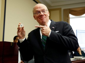 Representative-elect Ron Wright (R-TX) reacts to drawing number 6 during a lottery for office assignments on Capitol Hill in Washington, D.C., Nov. 30, 2018.