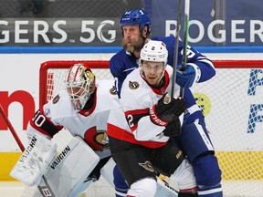 Maple Leafs forward Joe Thornton gets in front of the Ottawa Senators net, making it rough for defenceman Artem Zub and goalie Matt Murray on Feb. 17, 2021.