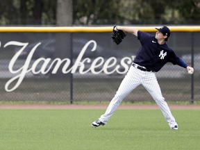 New York Yankees relief pitcher Zack Britton (53) works out on the first day of spring training at the Player Development Complex.