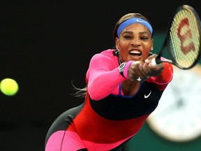 Serena Williams of the U.S. hits a return against Romania's Simona Halep during their women's singles quarter-final match on day nine of the Australian Open tennis tournament in Melbourne on Feb. 16, 2021.
