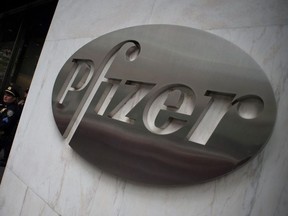 This file photo taken on April 27, 2016 shows the Pfizer company logo on the wall in front of Pfizer's headquarters in New York.