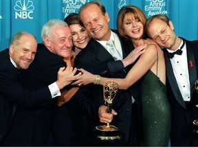 In this file photo taken on September 13, 1998 the cast of the television situation comedy "Frasier" pose with their Emmy for Outstanding Comedy Series at the 50th Annual Primetime Emmy Awards in Los Angeles (From L-R:) Dan Butler, John Mahoney, Peri Gilpin, Kelsey Grammer, Jane Leeves and David Hyde Pierce.