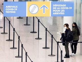 Passengers arrive at Toronto's Pearson airport after mandatory COVID-19 testing took effect for international arrivals, in Mississauga, Ont., Feb. 1, 2021.